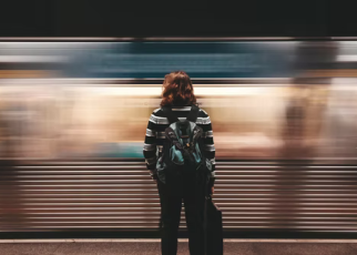 Woman-Standing-In-Subway