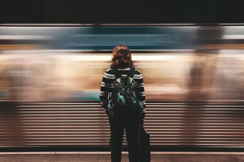 Woman-Standing-In-Subway